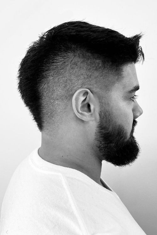 Black mohawk fade with short textured top and full beard