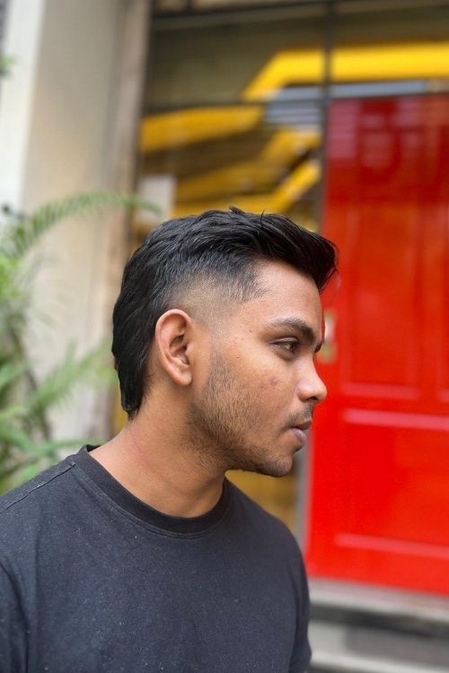 Black subtle mullet with undercut sides