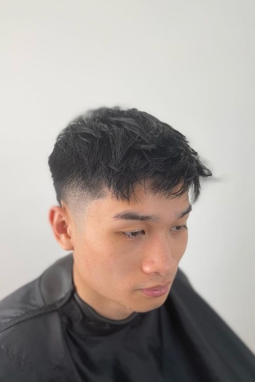 Black textured fringe with a skin fade