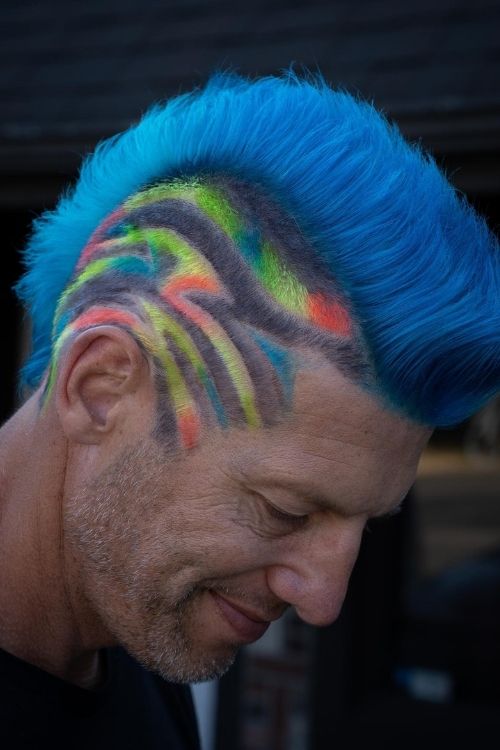 Blue mohawk with vibrant rainbow side patterns