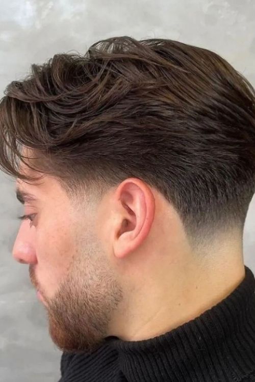 Brown low taper fade with textured top