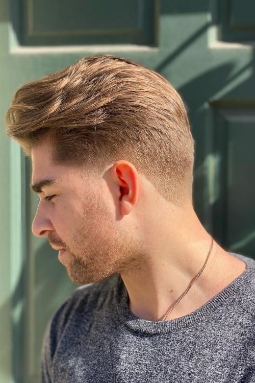 Classic taper fade with brushed back top