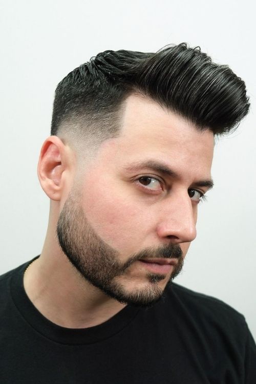 Dark pompadour with high fade short back and sides