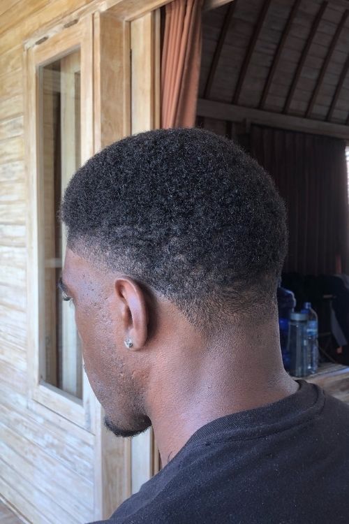 Low taper fade with short curls