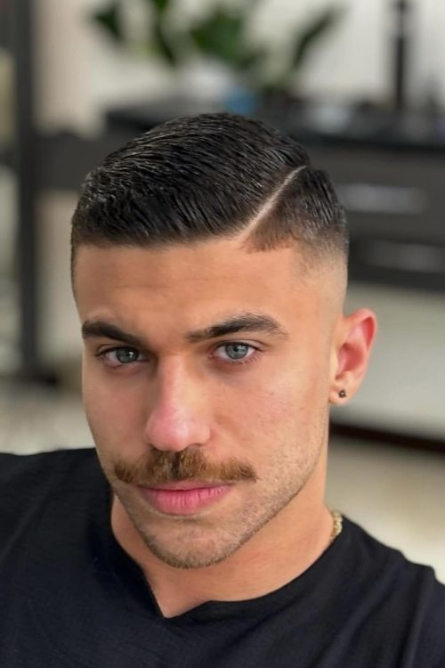 Slicked side part with skin fade dark natural color