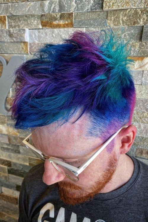 Vibrant blue and purple textured quiff undercut with faded sides.