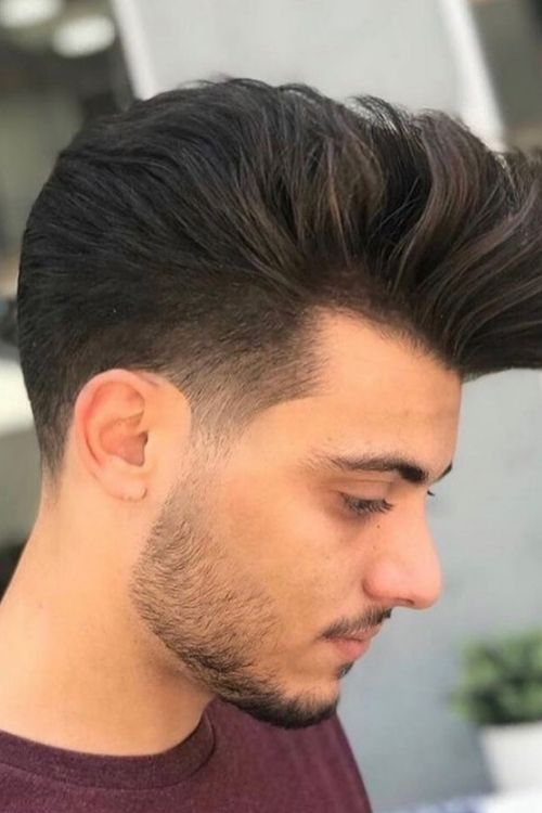 Voluminous quiff with low taper fade