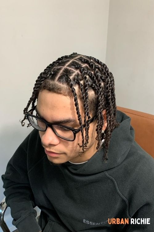 Black cornrow twists with middle part